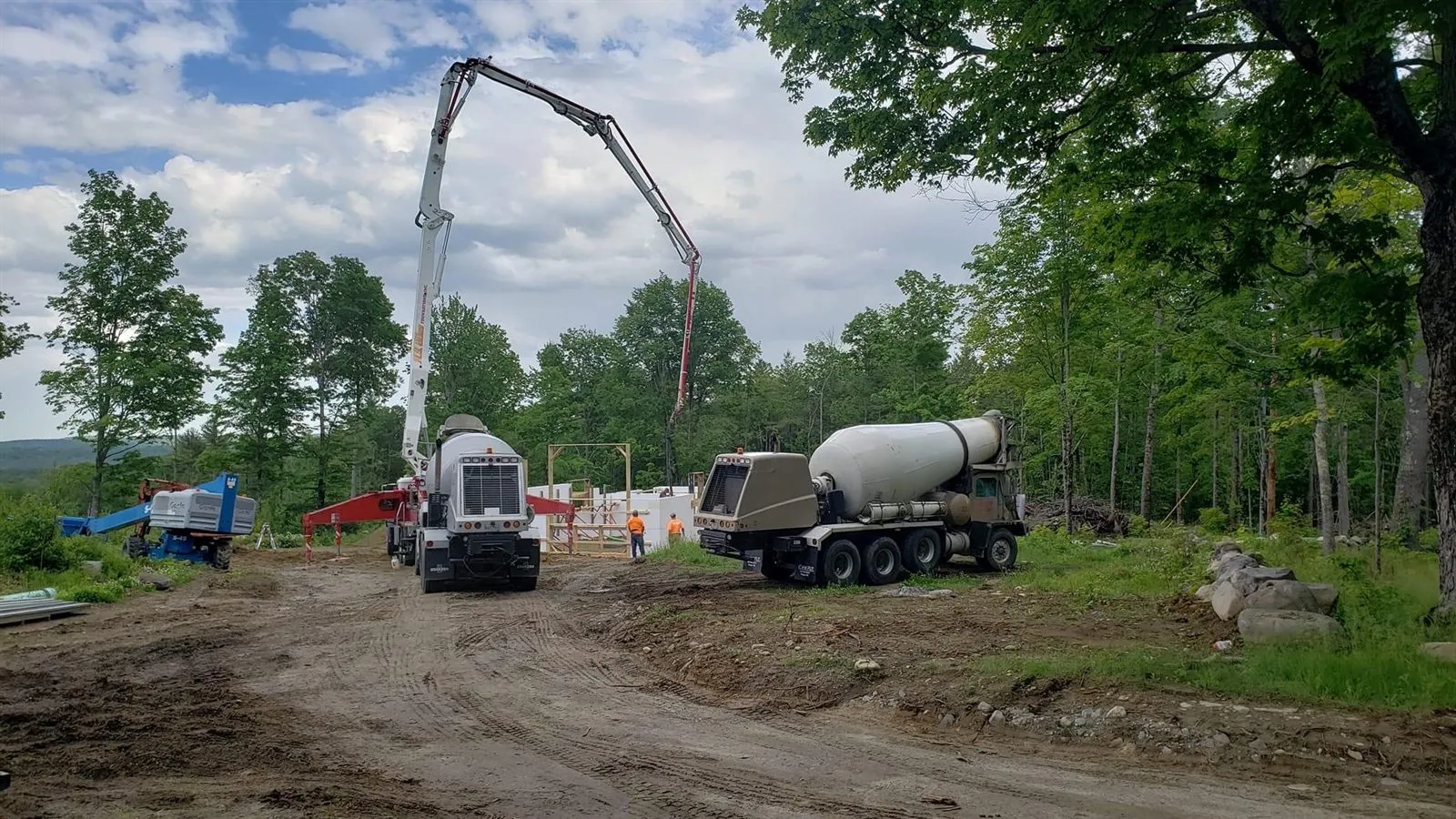Concrete pump truck and mixer set up to pour the ICF walls