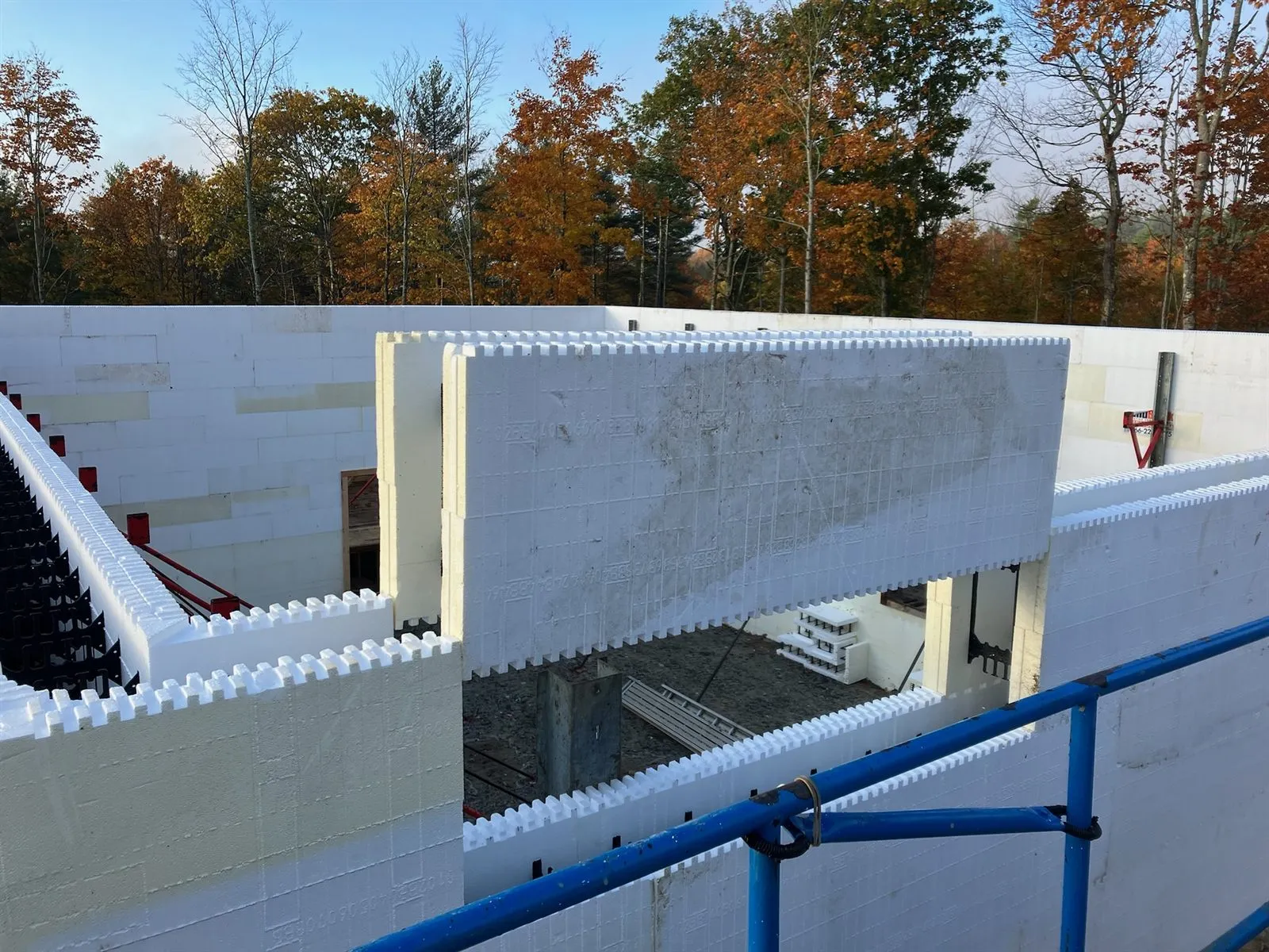 Interlocking ICF blocks stacked above a second-floor opening
